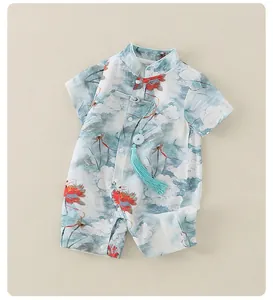 Detail of baby romper with traditional Chinese ink floral print and blue tassel accent