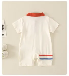 Detail view of cotton baby polo romper back with red collar and stripes in soft beige color