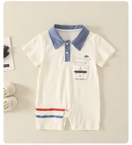 Detail of baby polo romper featuring a dog graphic, small pocket, and striped hem