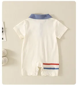 Detail of baby cotton polo onesie with blue collar and nautical striped leg accents