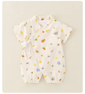 Detail of baby summer kimono romper with cute cartoon patterns and side tie closure