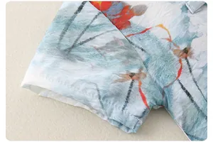 Detail of short sleeves with lotus ink painting on thin breathable cotton fabric