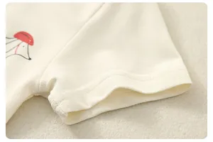 Detail of baby cotton pique shirt showing soft mesh texture and neat sleeve stitching