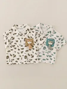Short sleeve cotton shirts for boys featuring pebble prints and 3D cartoon giraffe detail
