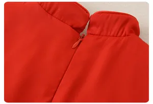 Detailed close-up of a red baby romper featuring a stand collar and back invisible zipper