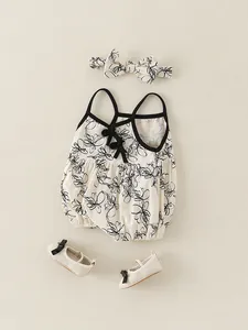 Ensemble body bébé à fleurs avec bandeau assorti et chaussons souples en crème et noir