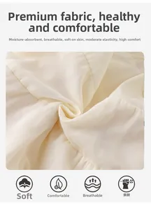 Gros plan du tissu en coton crème respirant montrant une texture douce et naturelle