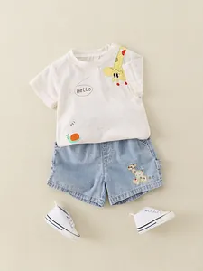 Kids summer cotton outfit set featuring white cartoon giraffe t-shirt and blue denim shorts