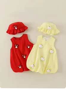 Detail of infant cotton sleeveless dresses with matching ruffle sun hats in red and yellow