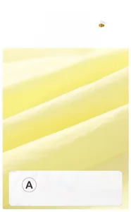 Close-up of yellow A-class pure cotton fabric showing soft texture for baby clothing