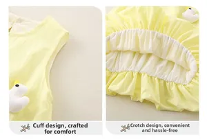 Detail of yellow cotton baby bodysuit with 3D duck toy and elastic leg openings