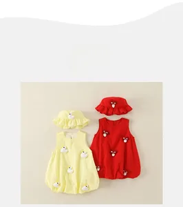 Detail view of cotton sleeveless baby bodysuits with yellow duck and red mushroom accents