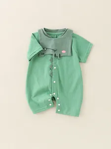 Green cotton baby romper with cute 3D cartoon dinosaur design and snap closure