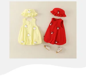 Detail of infant cotton sleeveless dress and matching sun hat with 3D cartoon embroidery