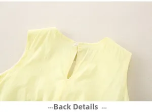 Close-up of the back detail on a yellow cotton baby dress with button closure