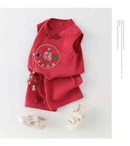 Detail of red cotton baby suit with traditional Chinese five toxins embroidery design