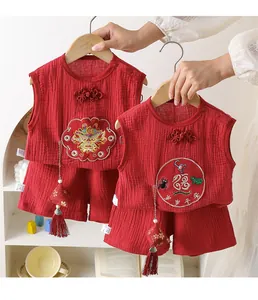 Detail of red cotton baby summer set with traditional Chinese embroidery and knots