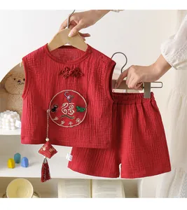 Close-up of traditional cotton baby suit with embroidery and Chinese frog button details