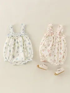 Floral baby girl bodysuits set with ruffle straps and bottom snaps on white background