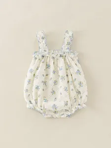 Floral baby bodysuit with ruffle sleeves and blue floral pattern on cream fabric