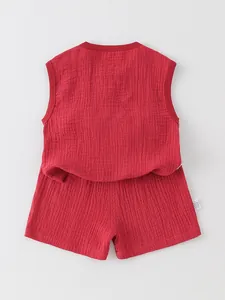 Traditional red cotton muslin infant vest and shorts set with natural crinkle texture