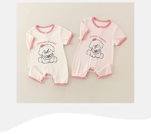 Detail showing soft cotton ribbed baby rompers with Cream Puppy print and snap buttons
