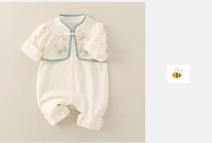 Detail of baby cotton romper with traditional Chinese frog buttons and embroidery