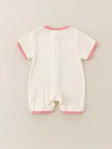 Short-sleeve baby romper in cream knit fabric with pink trim accents for summer