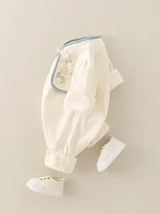 Infant cotton romper with traditional Chinese frog buttons and embroidered floral details