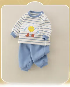 Detail of baby cotton set with striped long sleeve top and blue elasticated pants