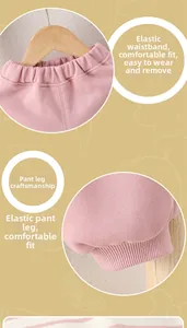 Detail of pink cotton baby pants showing elastic waistband and ribbed cuffs