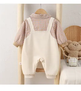 Detail of baby boy cotton plaid romper set with suspenders and rib-knit cuffs