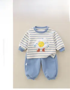Detail of baby cotton long sleeve set featuring blue striped top and matching pants
