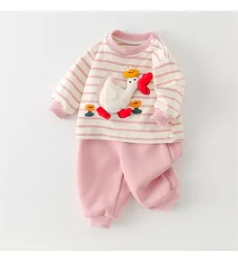 Detailed view of baby cotton striped pajama set with a 3D white duck applique