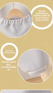 Detail of baby grey trousers showing elastic waistband and ribbed cuffs in soft cotton