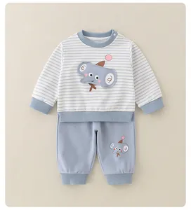 Close-up of blue striped cotton sweatshirt with cute elephant embroidery and side snaps