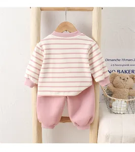 Pink striped baby cotton outfit set with long sleeve top and pants on wooden hanger