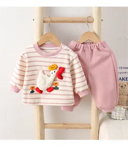 Detailed view of baby cotton set featuring 3D cartoon goose and striped long sleeve top