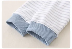 Macro detail of soft ribbed cotton cuffs on a blue striped long sleeve baby outfit