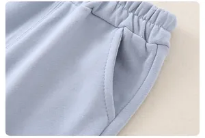 Detail of boys' light blue striped jogger with elastic waistband and side pocket stitching