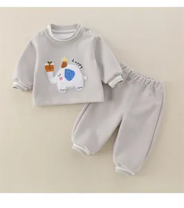 Detail of baby gray cotton sweat suit featuring a cute elephant patch and happy embroidery