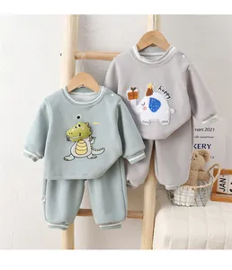 Detail of baby thermal sweatpants set with 3D dinosaur embroidery and ribbed cuffs