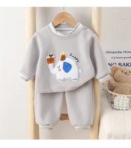 Close-up of elephant embroidery and happy lettering on baby cotton sweatshirt set