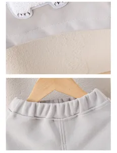 Close-up of baby knit set showing high-quality fabric texture and ribbed hem detailing