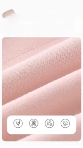 Macro shot of pink combed cotton fabric showing soft knit texture for baby clothes