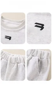 Detail showing classic crew neck, chest print, elastic waistband, and side pockets of cotton set