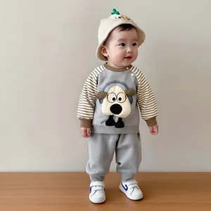 Close-up of the cotton ribbed cuffs and sheep cartoon detail on the baby autumn set