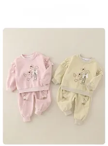 Detailed view of floral embroidery and bow accents on toddler cotton sweatshirt sets