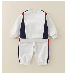 Back view of gray cotton baby lounge set with navy and red contrast side stripes