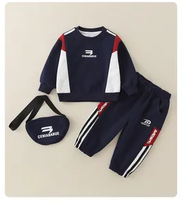 Detail of baby boy cotton tracksuit set with navy blue color-block sweatshirt and pants